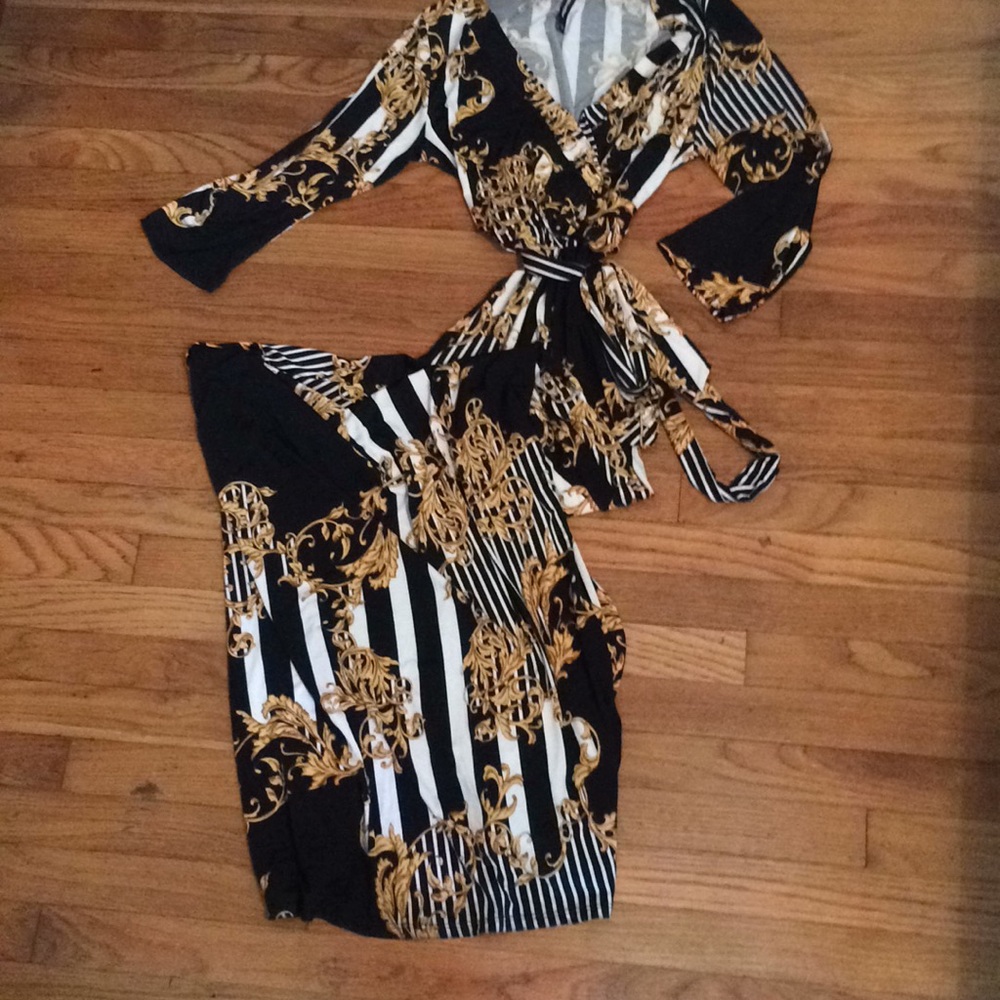 Women’s black white and gold dress